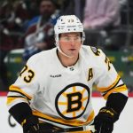 Bruins’ Charlie McAvoy exits Saturday’s game after being hit by puck