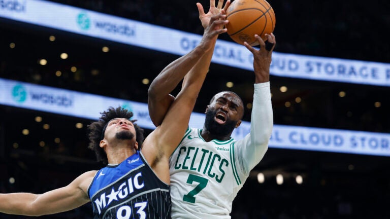 Brown, Celtics hold off late push by short-handed Magic in win